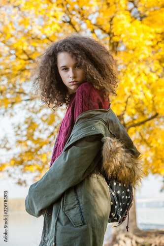 Teen girl in autumn park