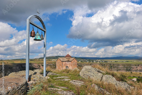 Bells on a background of St. George's Dome Church located above the Dashbashi canyon in Tsalka region, Georgia photo