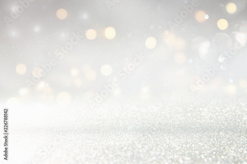glitter vintage lights background. silver and light gold de-focused. © tomertu