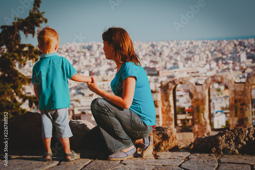 mother and son looking at the city of Athens, Greece from Acropolis