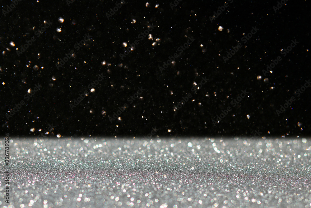 Obraz premium glitter vintage lights background. black and silver. de-focused.
