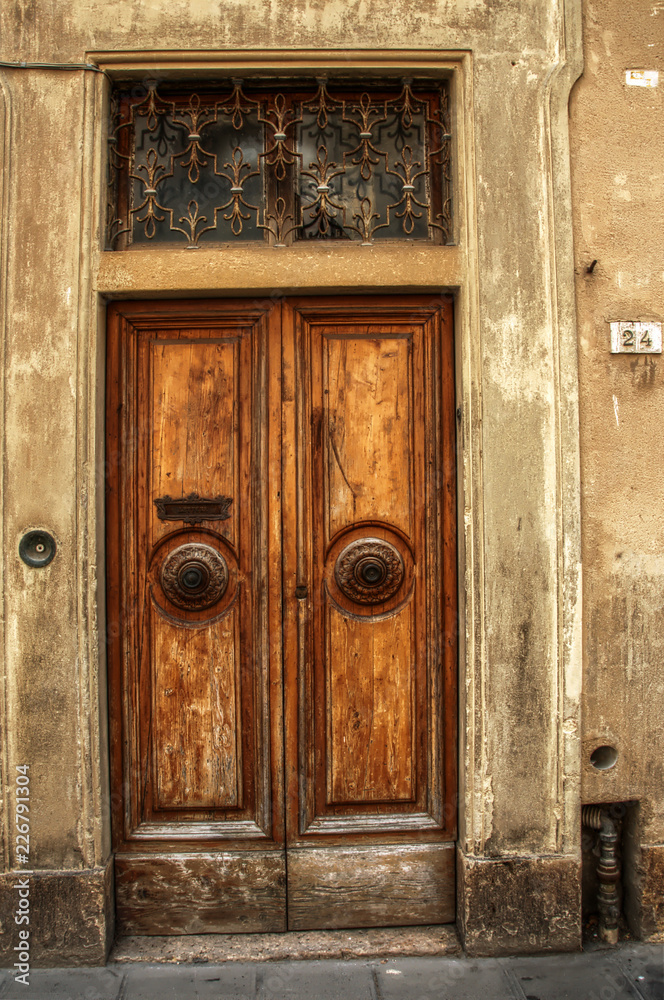 Tuscan wooden doorway and wall, Certaldo