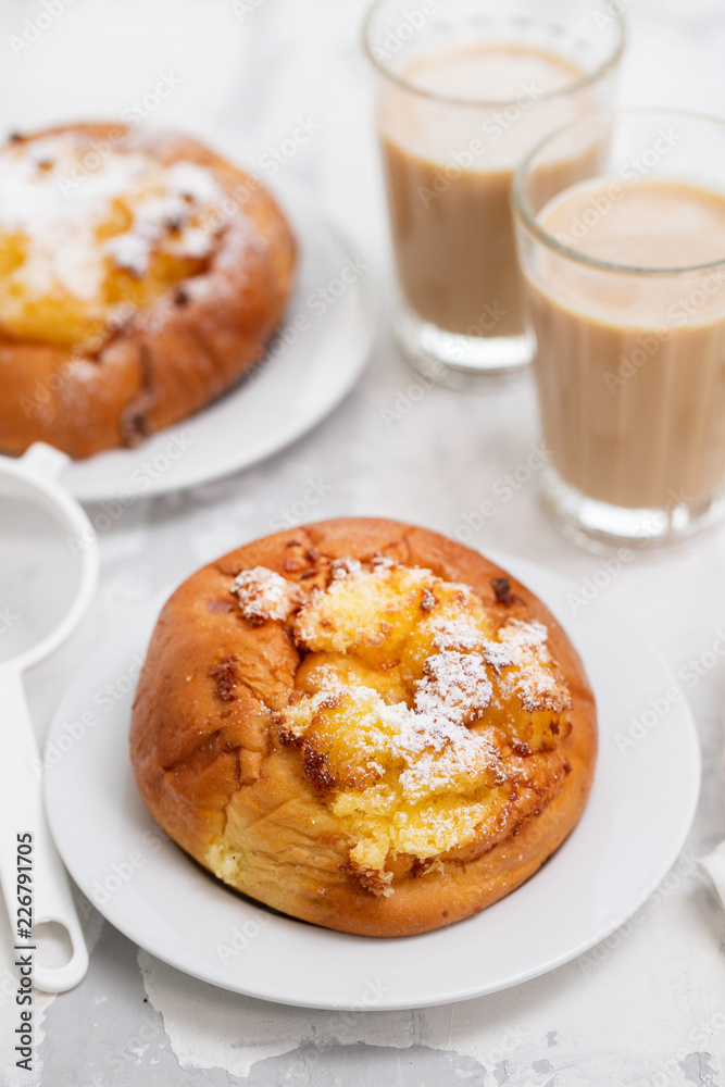 portuguese sweets with coconut Pao de Deus and coffee with milk portuguese sweets with coconut Pao de Deus and coffee with milk