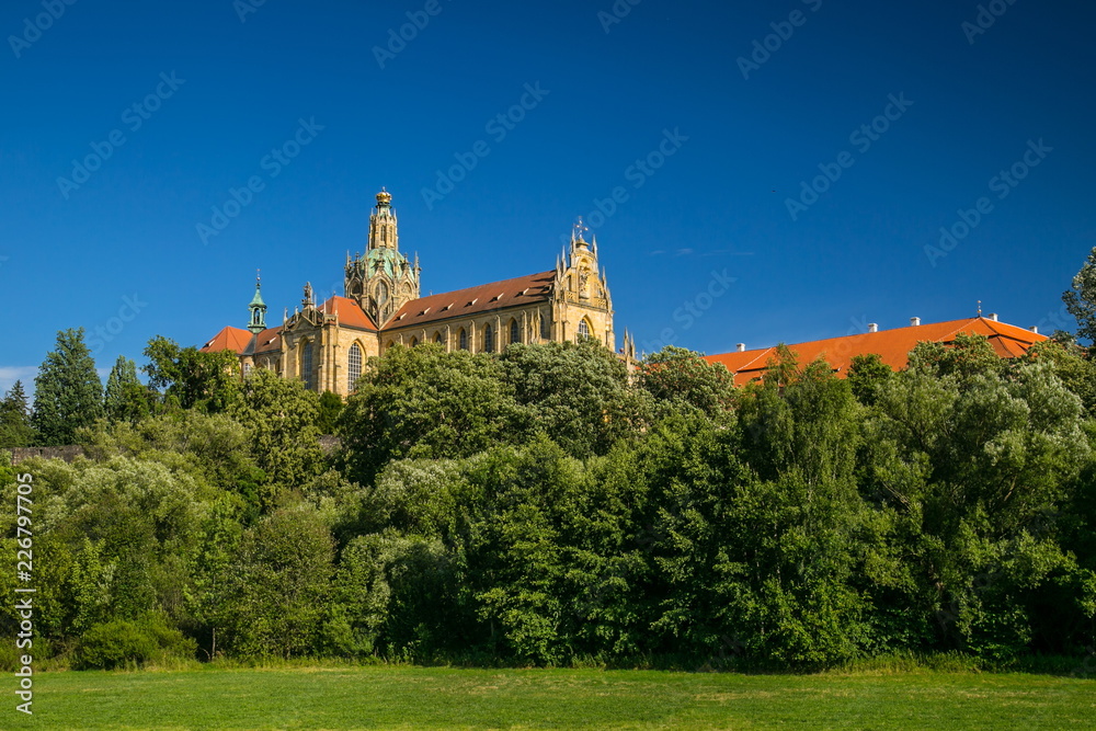 View of famous monastery of Benedictines in Kladruby, Czech Republic, Europe, from distance, this monumental architecture standing on green hill comes from 12th century