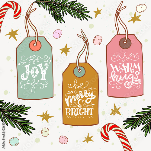 Holiday lettering on hand drawn xmas gift tags