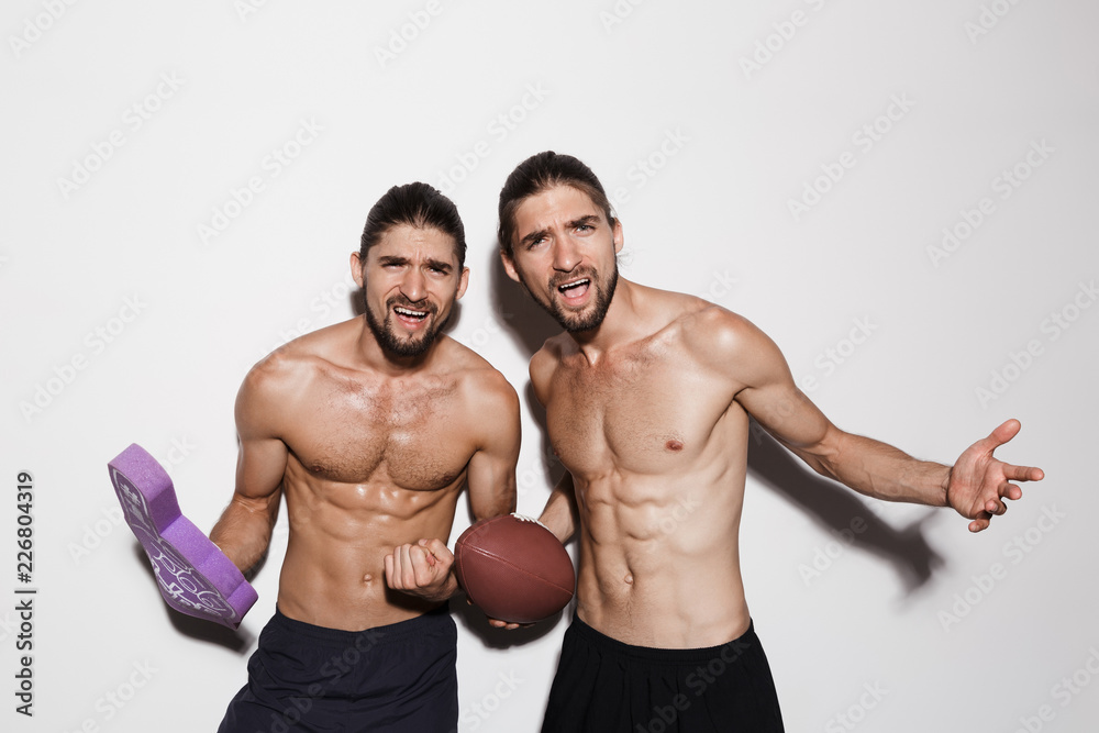 Portrait of a two muscular shirtless twin brothers Portrait of a two muscular shirtless twin brothers