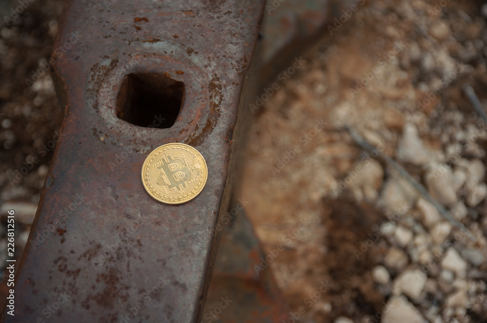 Bit coin on anvil