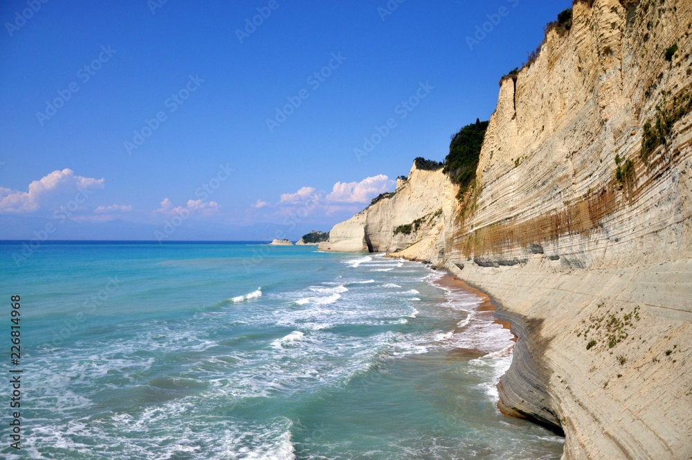 Cape Drastis detail in summer, Cape Drastis beach during tide, cliff rock Drastis in the island Corfu in Greece