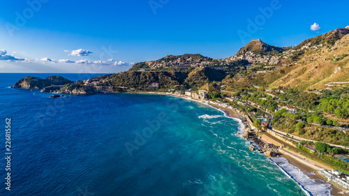 Aerial. View from beach toTaormina. Taormina has been a tourist destination since the 19th century. Located on east coast of the island of Sicily, Italy.