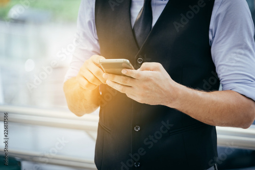 business man use smartphone technology outdoor