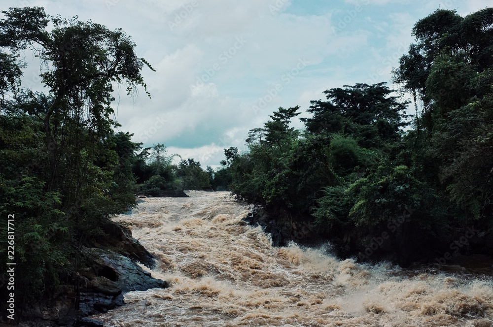 waterfall along the mekong river at the 4000 island border area in the middle of the rainforest jungle waterfall along the mekong river at the 4000 island border area in the middle of the rainforest jungle
