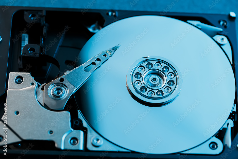 Disassembled hard drive from the computer, hdd with mirror effect. Opened hard drive from the computer hdd with mirror effects. Part of computer pc, laptop Disassembled hard drive from the computer, hdd with mirror effect. Opened hard drive from the computer hdd with mirror effects. Part of computer pc, laptop