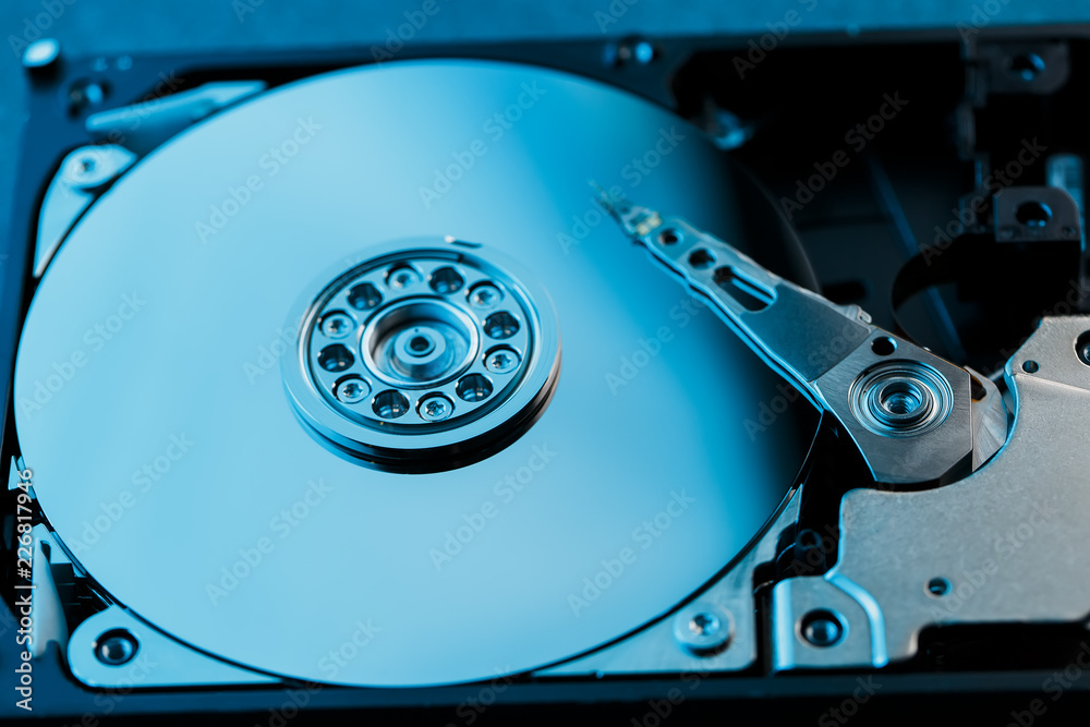 Disassembled hard drive from the computer, hdd with mirror effect. Opened hard drive from the computer hdd with mirror effects. Part of computer pc, laptop Disassembled hard drive from the computer, hdd with mirror effect. Opened hard drive from the computer hdd with mirror effects. Part of computer pc, laptop