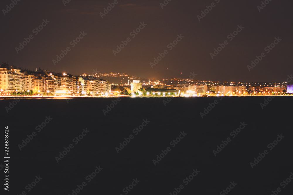 Beach in the evening of Thessaloniki, Greece.Night lanterns. The light of the night city.