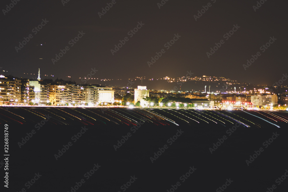 Fototapeta premium Beach in the evening of Thessaloniki, Greece.Night lanterns. The light of the night city.