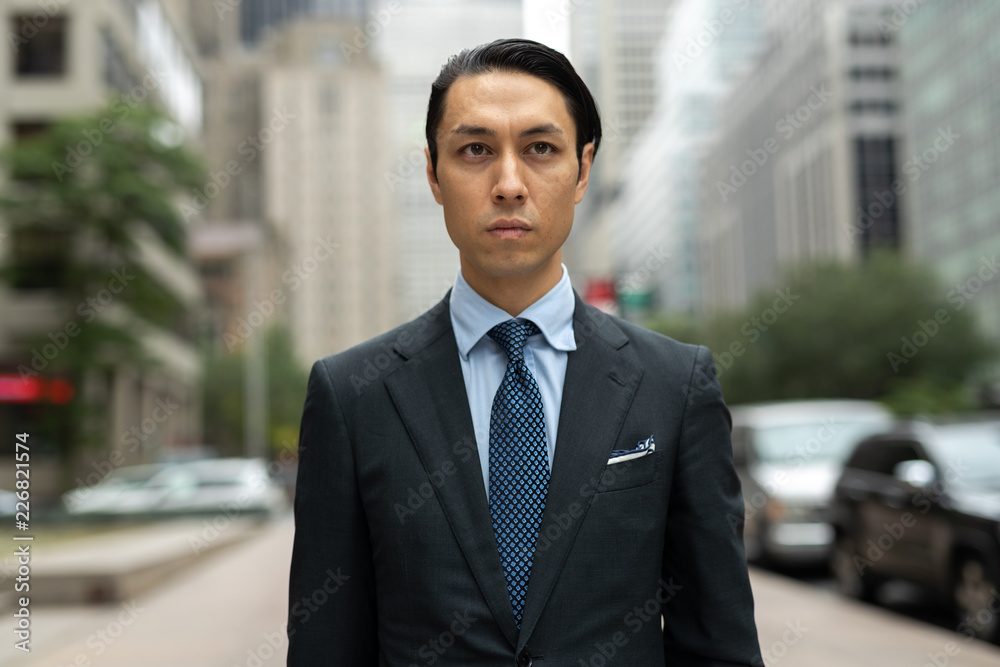 Asian businessman in city walking street Asian businessman in city walking street