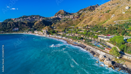 Aerial. Beach view near Taormina.  Taormina has been a tourist destination since the 19th century. Located on east coast of the island of Sicily  Italy.