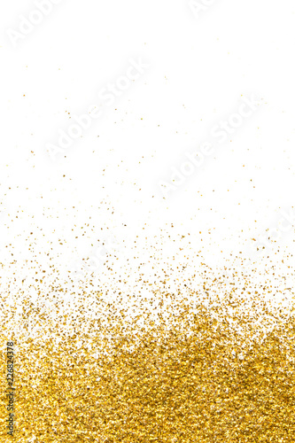 Golden glitter in the form of a gradient on a white background.