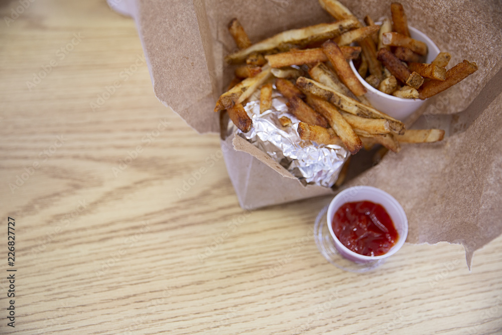 French fries on brown paper