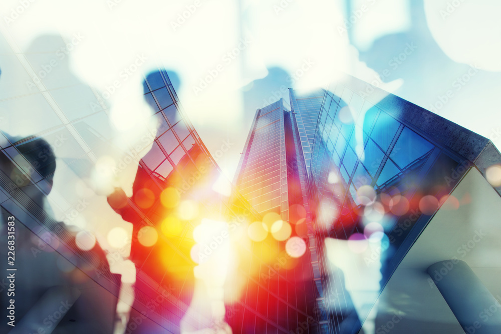 Silhouette of business people work together in office. Concept of teamwork and partnership. double exposure with network effects Silhouette of business people work together in office. Concept of teamwork and partnership. double exposure with network effects