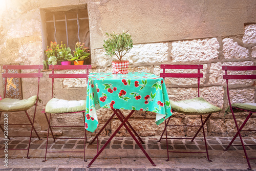 Fototapeta Naklejka Na Ścianę i Meble -  Cosy vintage cafe terrace in a street of Cassis on the French rivieria, France
