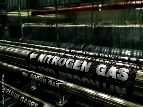 Black gas pipe line under raised floor. Fuel and energy industrial concept