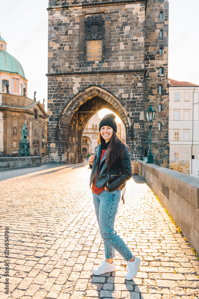 woman portrait at sunrise at charles bridge in prague