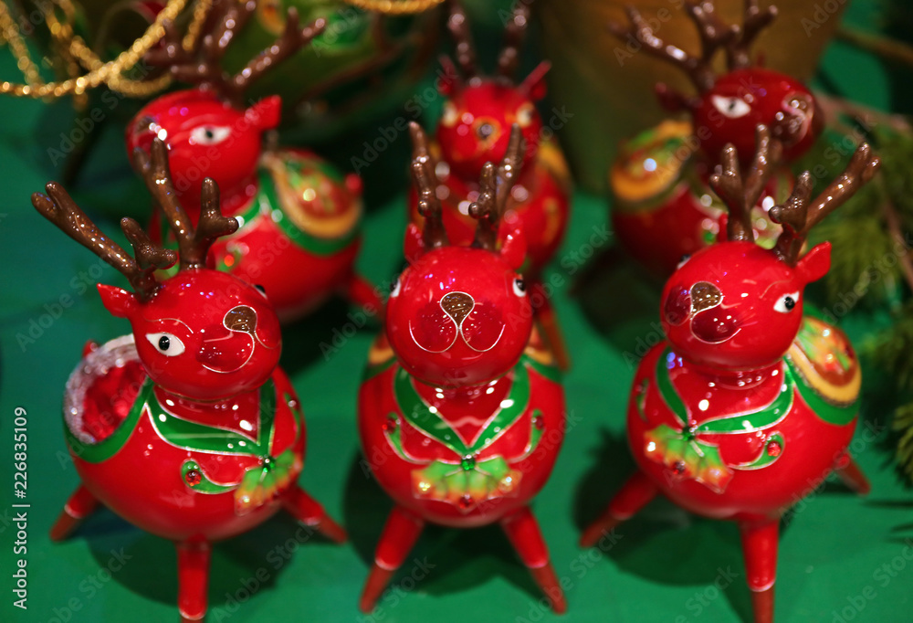 Group of Decorated Vibrant Red Ceramic Reindeer for Christmas Home Decoration 