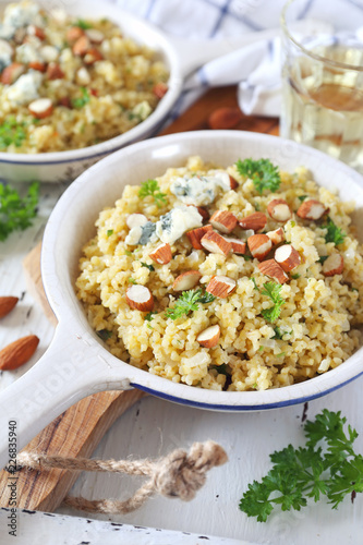 Bulgur cereal risotto with blue cheese, parsley and almonds, two servings