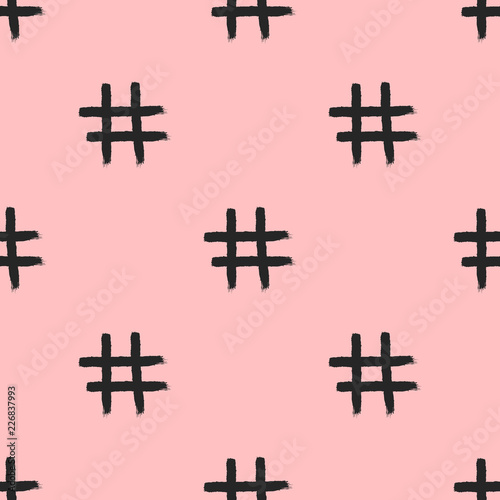 Seamless pattern with repeated hashtag icon drawn by hand with rough brush. Sketch, watercolour, paint.