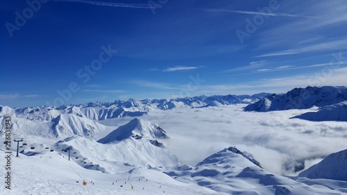 Image of ski resort in the mountains with low stratus over the valleys © Alex
