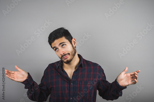 Konstfotografi Closeup portrait young handsome, happy, smiling, conformist man, worker giving ok sign with hands