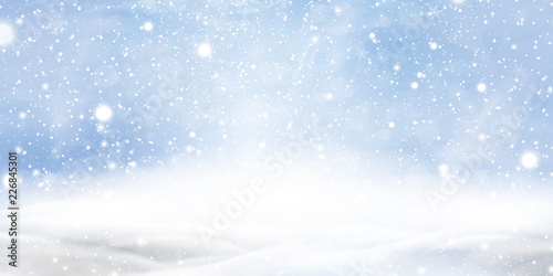 Natural Winter Christmas background with blue sky, heavy snowfall, snowflakes in different shapes and forms, snowdrifts. Winter landscape with falling christmas shining beautiful snow.