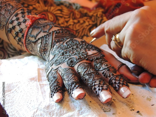 henna on female hands photo