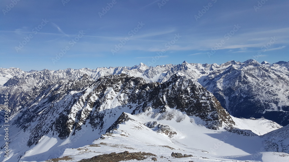 Image of snow covered mountain peaks in the alps