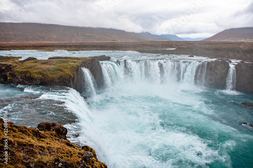 Icelandic waterfall in Icelandic natural landscape. Famous sights and attractions in Icelandic natural landscape on Southern Iceland