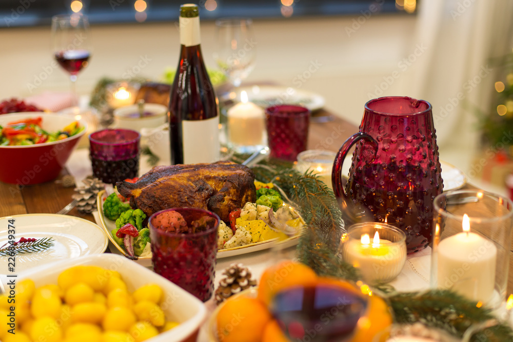 christmas dinner and eating concept - food and drinks on table at home christmas dinner and eating concept - food and drinks on table at home