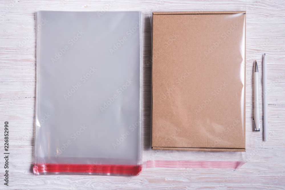 Clear plastic bags and cardboard box Clear plastic bags and cardboard box