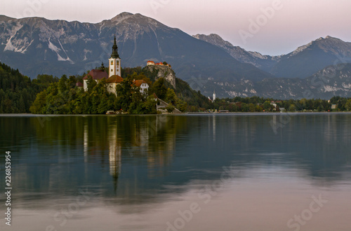 Beautiful mountain lake Bled . Pilgrimage Church of the Assumption of Maria situated on an island . Mountains in background. Slovenia, Europe. European travel. © notistia