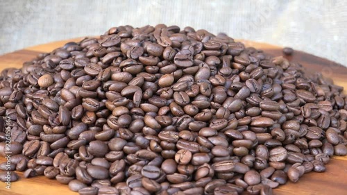 A coffee bean is a seed of the coffee plant and the source for coffee. It is the pit inside the red or purple fruit often referred to as a cherry. photo