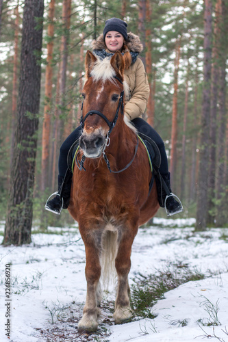 Cheerful nice girl with a horse. Country Equestrian Club. Winter trip out of town © Полина Власова