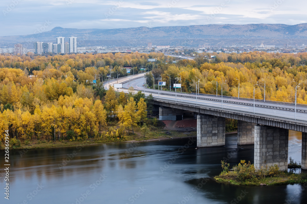 Bridge over Yenisey river in Krasnoyarsk, Russia in autumn.