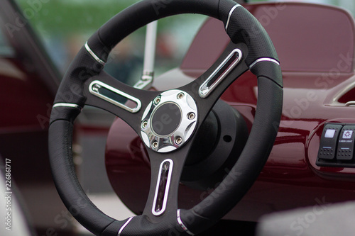 Steering wheel of a motor boat closeup. Transport © DmyTo