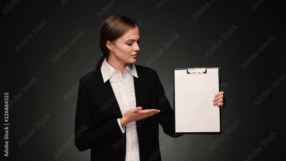 Attractive brunette bussines woman with blank pad Attractive brunette bussines woman with blank pad