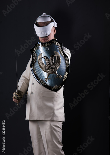 businessman in helmet with shield and sword
