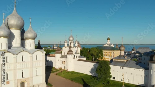 Aerial view of Rostov Kremlin area and Nero lake at sunset. Popular tourist route Golden Ring of Russia