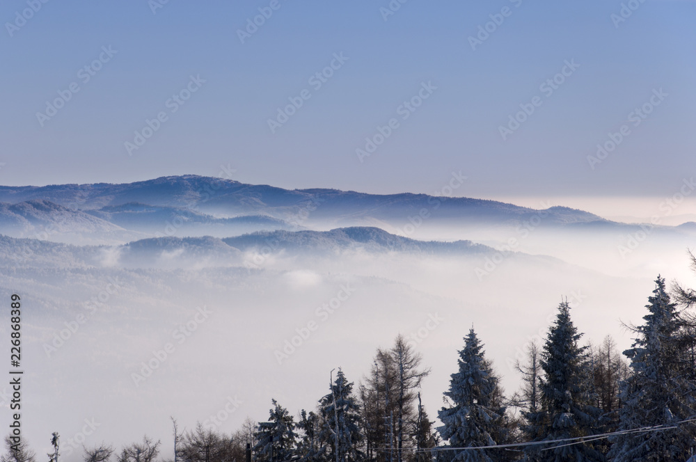 winter mountains up above the clouds