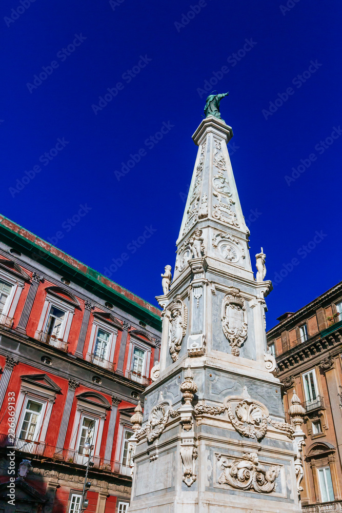 Spire of San Domenico  in downtown Naples, Italy
