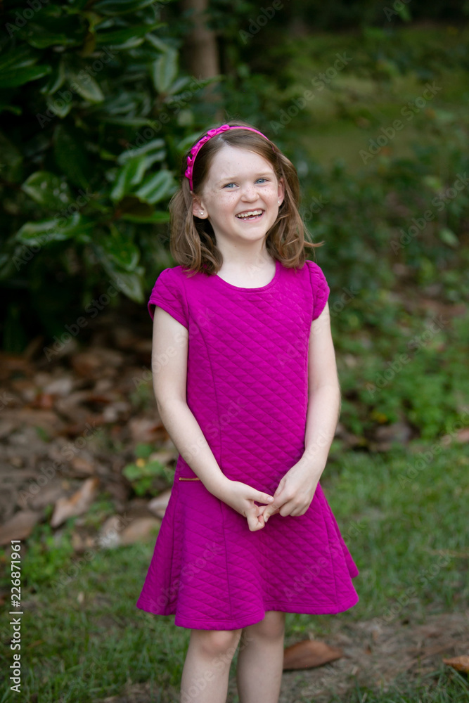 Happy Little Girl in Pink Dress Outside Happy Little Girl in Pink Dress Outside