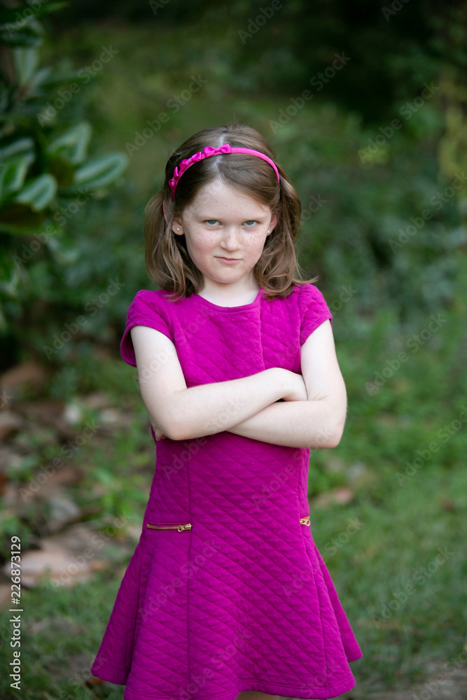 Sullen Little Girl With Attitude Outside with Arms Crossed
